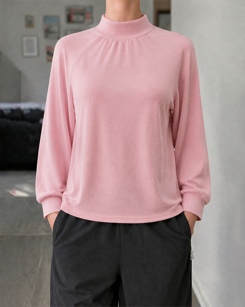 Woman wearing Zeagoo Maye's Pink Sweater in support of Breast Cancer Awareness Month.